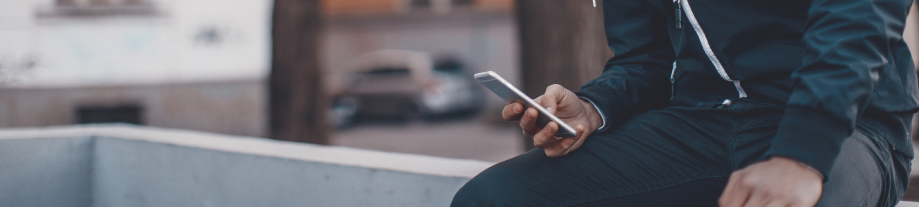 A man using a mobile phone outside